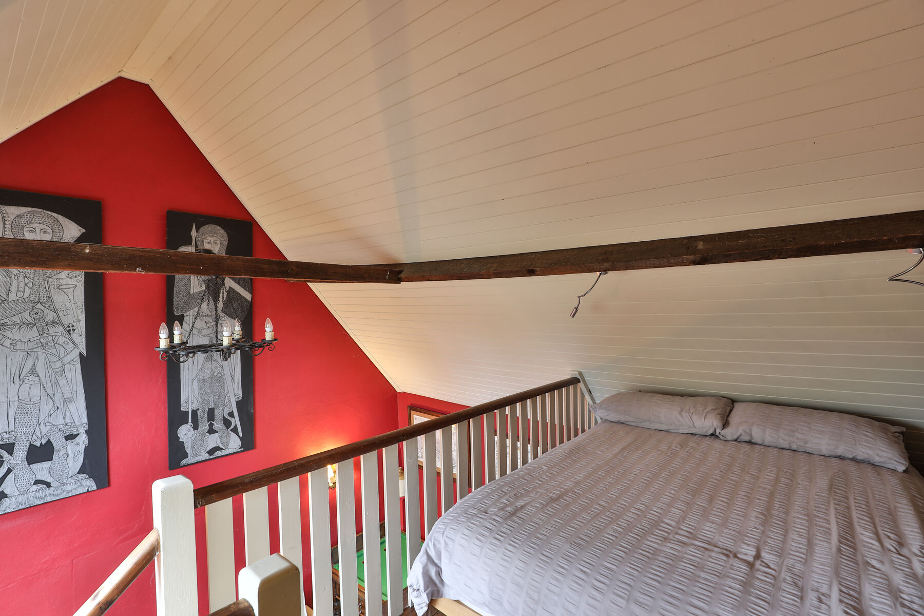 The mezzanine double bed in the Minstrels' Gallery